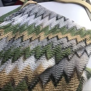 A woman’s multicolored around the shoulder .